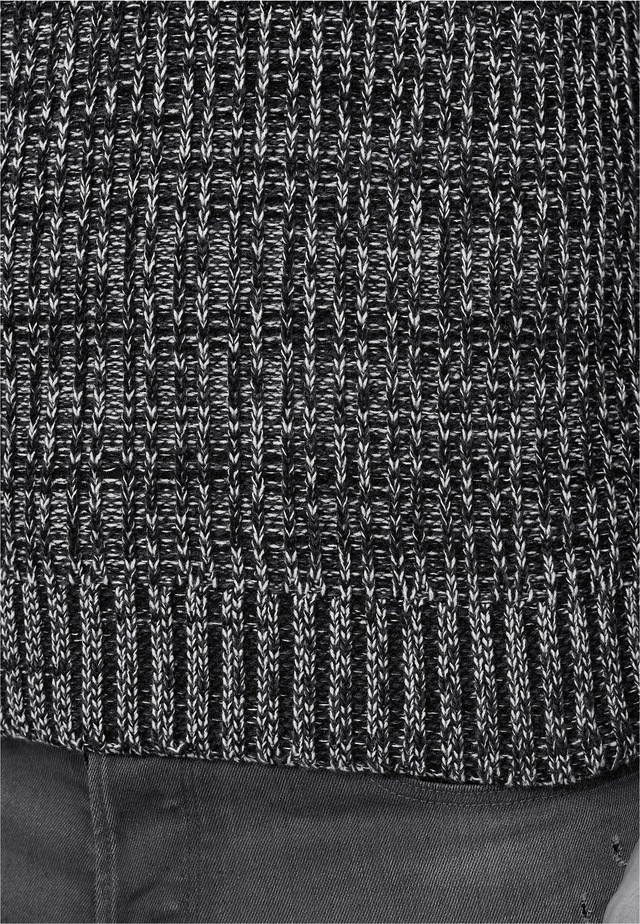 Rusty Neal Rollkragenpullover im angesagten Strickdesign