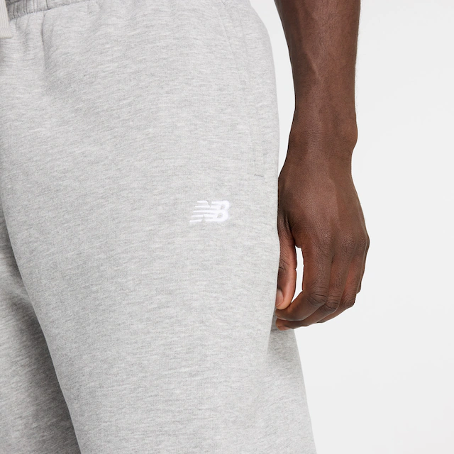 New Balance Jogginghose »SPORT ESSENTIALS FLEECE JOGGER« mit Eingrifftaschen, aus Fleece, lockere Passform