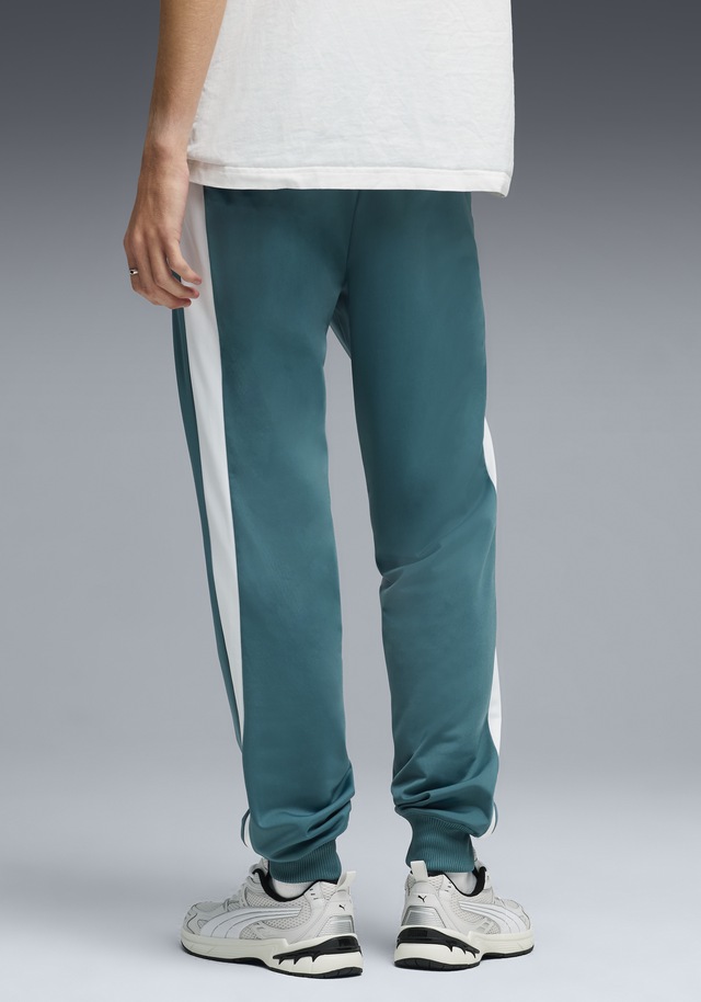 PUMA Trainingshose »T7 FOUNDATION CL POLY KNITTED PANTS« mit Eingrifftaschen, Regular Fit, sportlicher Stil