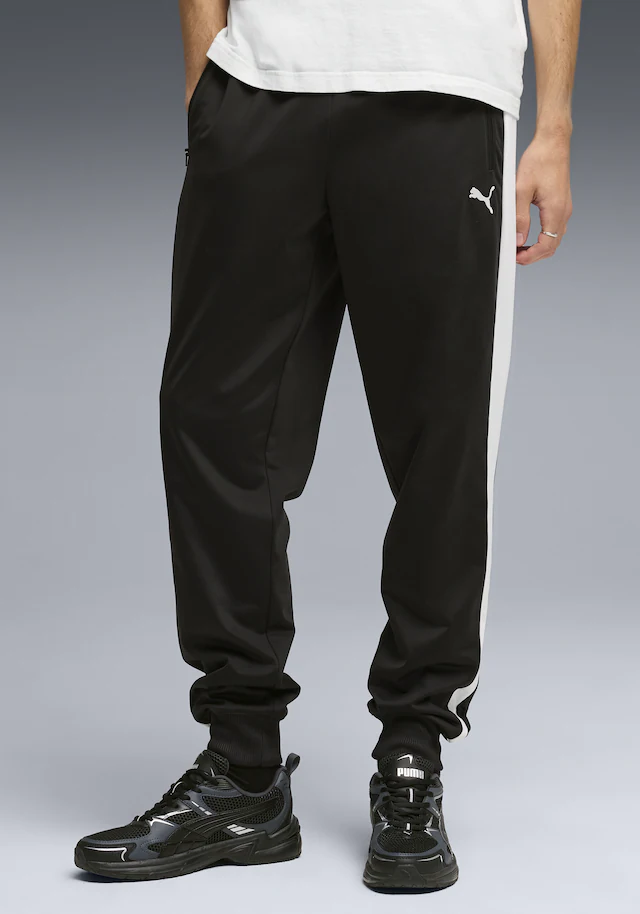 PUMA Trainingshose »T7 FOUNDATION CL POLY KNITTED PANTS« mit Eingrifftaschen, Regular Fit, sportlicher Stil
