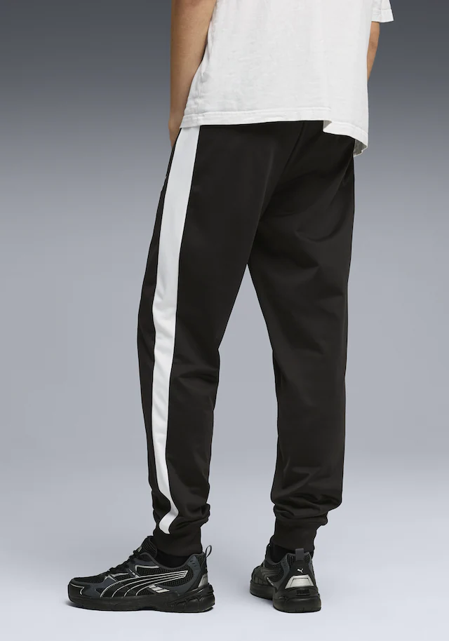 PUMA Trainingshose »T7 FOUNDATION CL POLY KNITTED PANTS« mit Eingrifftaschen, Regular Fit, sportlicher Stil