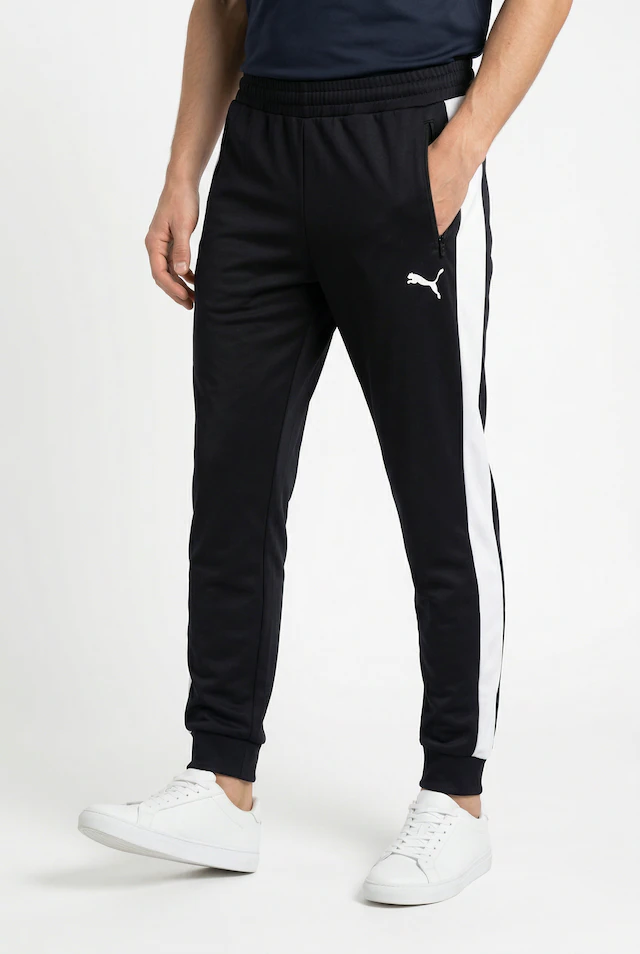 PUMA Trainingshose »T7 FOUNDATION CL POLY KNITTED PANTS« mit Eingrifftaschen, Regular Fit, sportlicher Stil