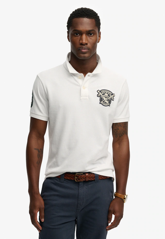 Superdry Poloshirt »CREST POLO« mit Markenlabel, aus Baumwolle, Relaxed Fit, bedruckte Optik