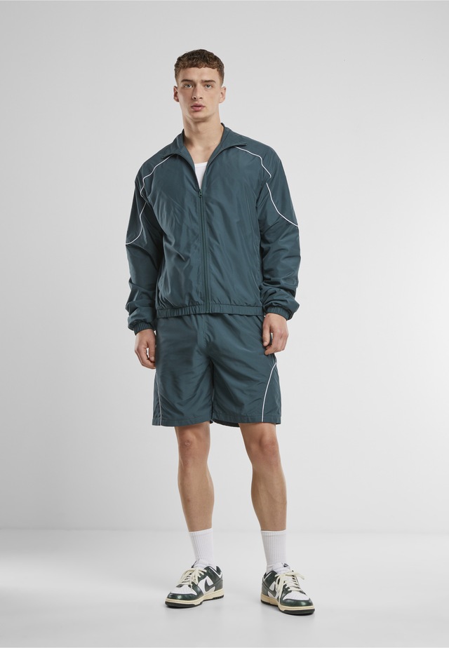 URBAN CLASSICS Trainingsjacke »Urban Classics Piped Panel Trackjacket« 1 Stk. tlg. ohne Kapuze