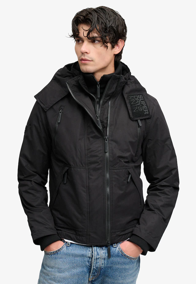 Superdry Outdoorjacke »HOODED MF ARCTIC WINDCHEATER« mit Kapuze Kunstfaser, loose fit