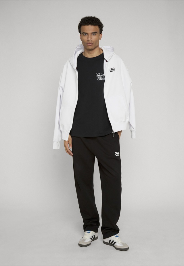 URBAN CLASSICS T-Shirt »Urban Classics Urban Classics Flow Script Logo Loose Tee« 1